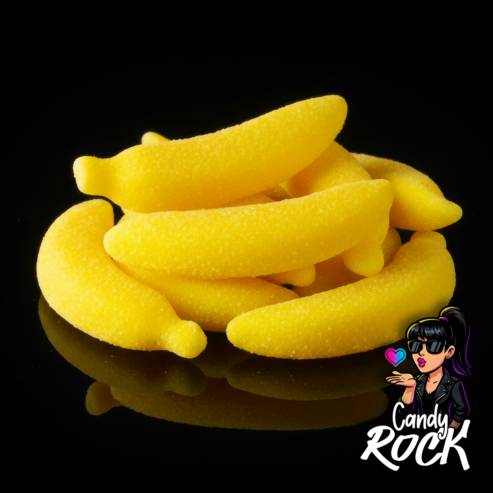 Vue rapprochée de bananes gélifiées géantes jaunes, détail du sucre fin et de la texture moelleuse CandyRock.