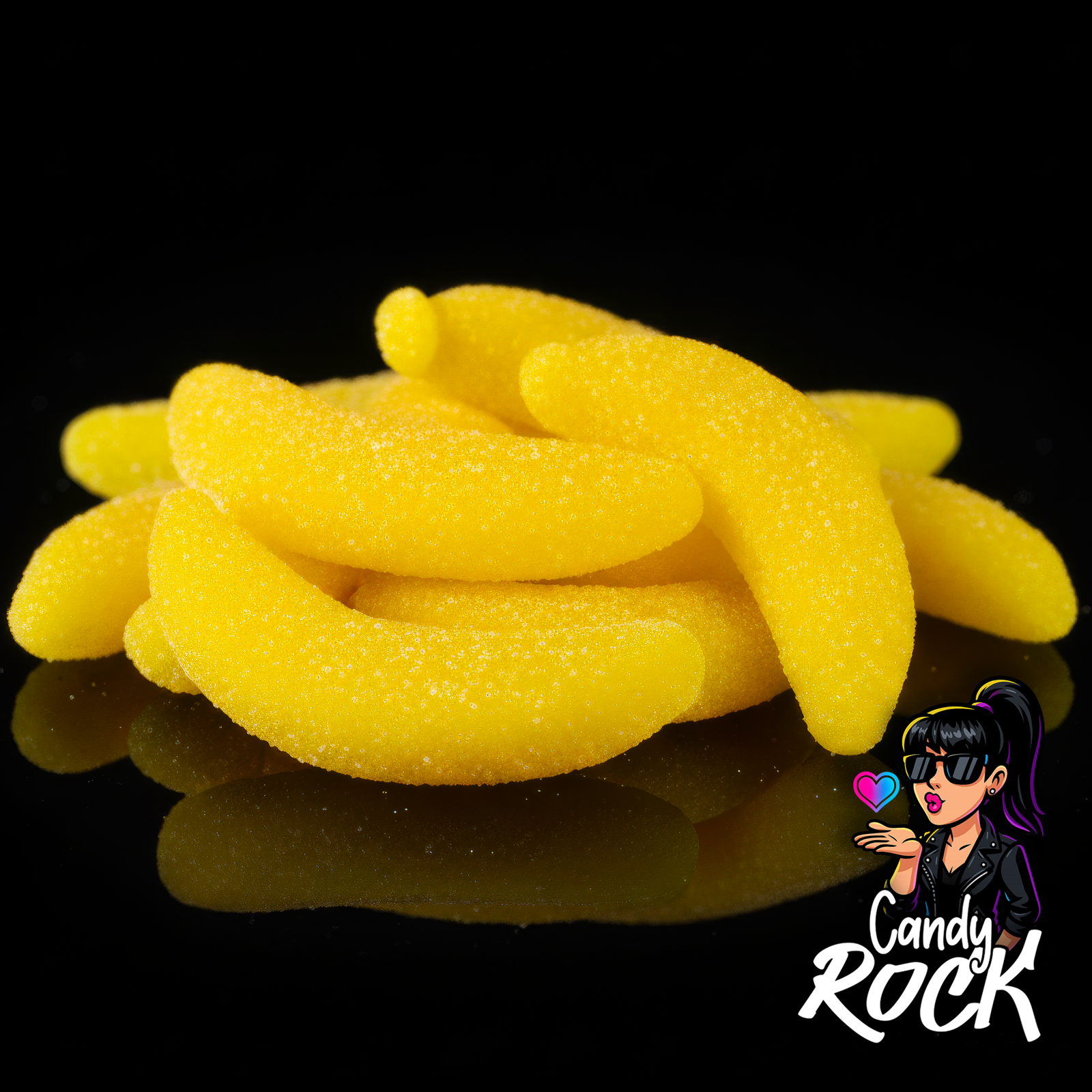 Zoom sur les bananes gélifiées jaunes, détail de l’enrobage sucré et de la texture moelleuse CandyRock.