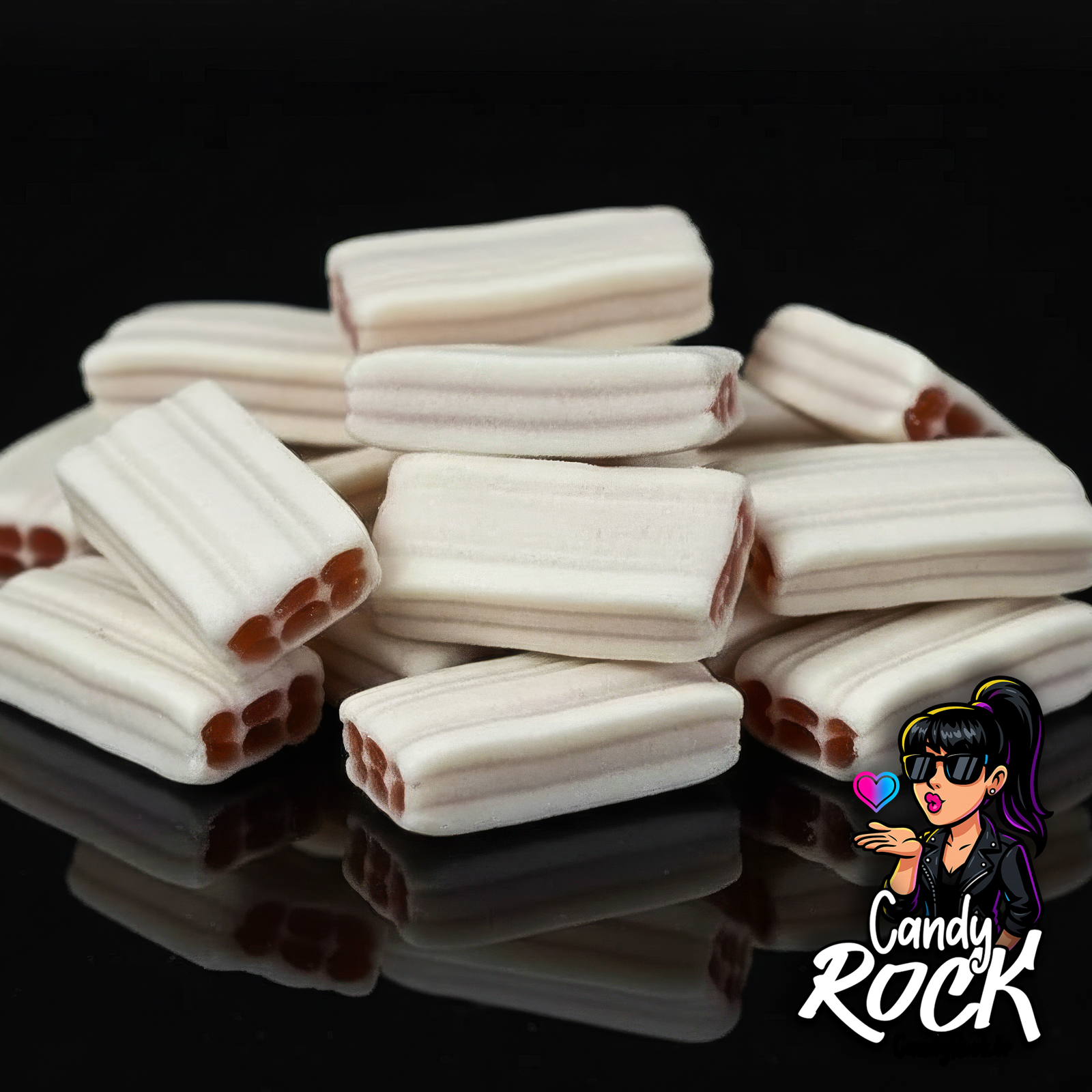 Zoom sur des briques lissées blanches au cœur fraise rouge, texture lisse et crémeuse mise en avant, CandyRock.