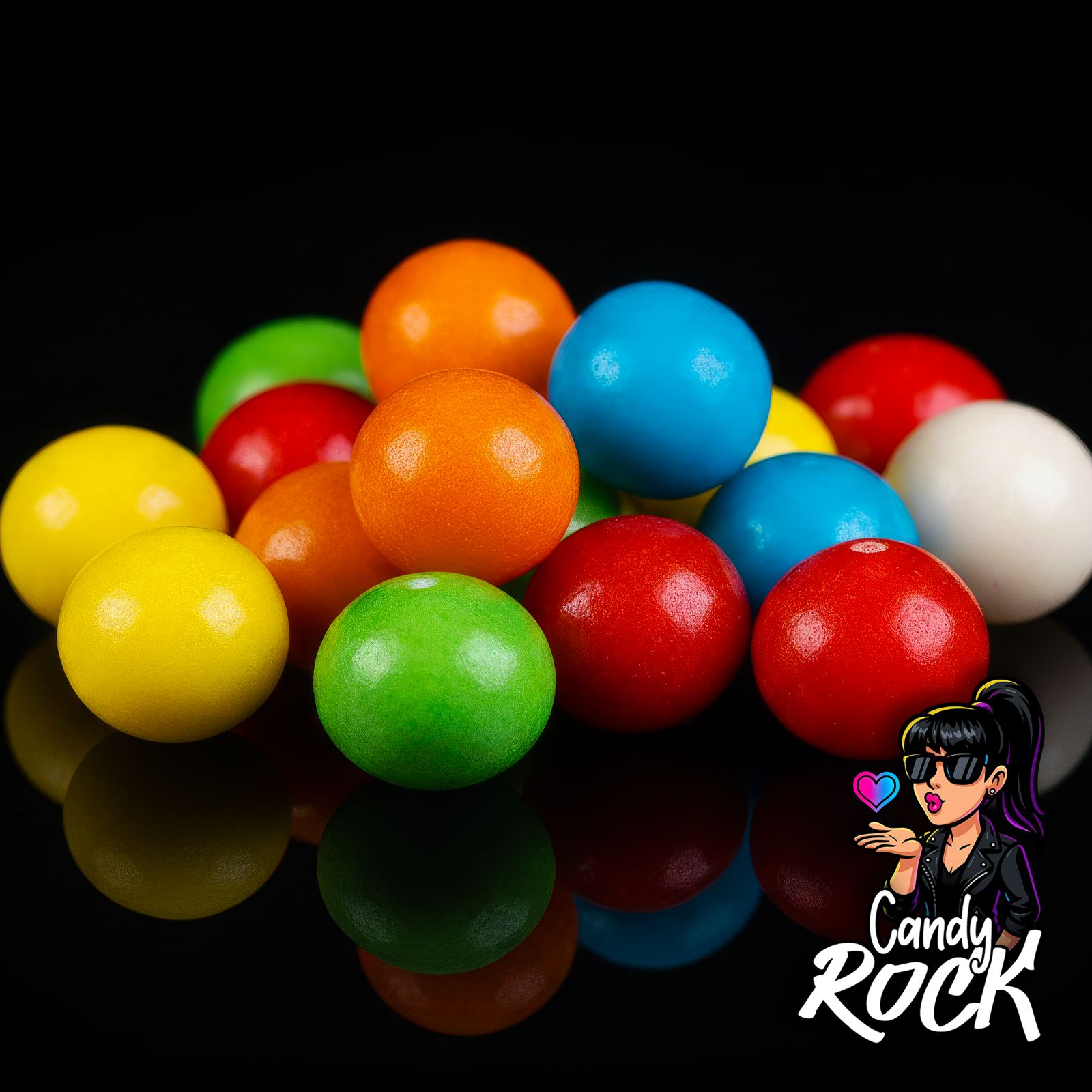 Vue rapprochée de billes chewing-gum assorties au revêtement lisse et cœur acidité, ambiance fun CandyRock.