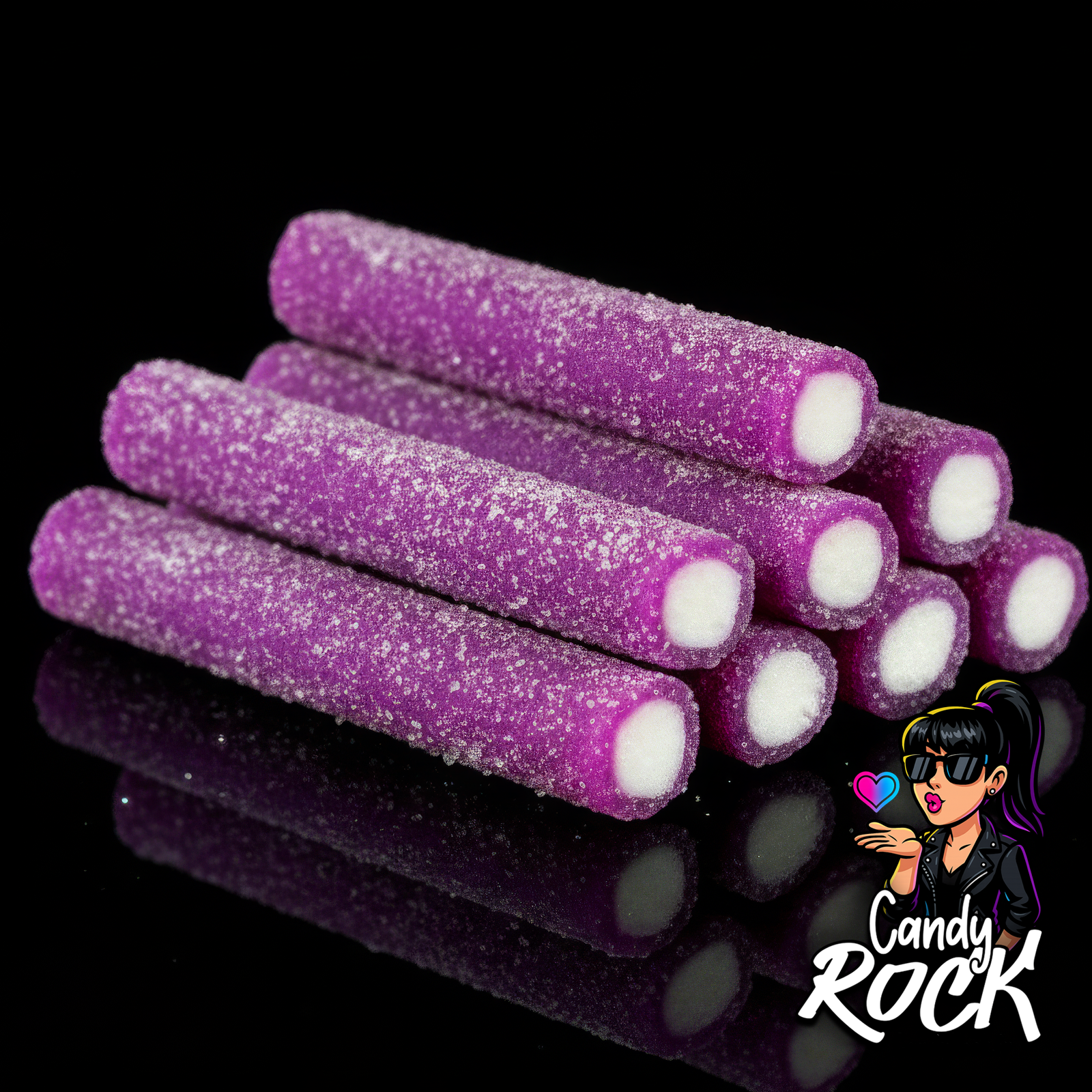 Gros plan sur plusieurs jumbo sticks violets au sucre acidulé avec cœur blanc moelleux, ambiance CandyRock.